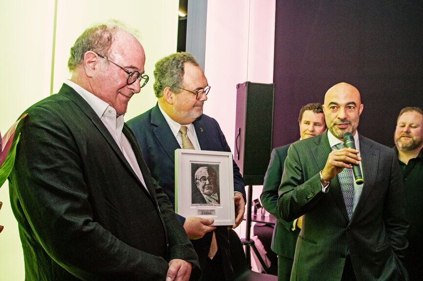 From left: Dr Kenneth Malament receiving the P-I Brånemark Award for Lifetime Achievement in Dentistry on behalf of Prof. Joerg R Strub, with  Mark Ferber (middle) founder of Channel3 and Dental Tribune International CEO Torsten Oemus. (Photograph: Luke Gribble, DTI)