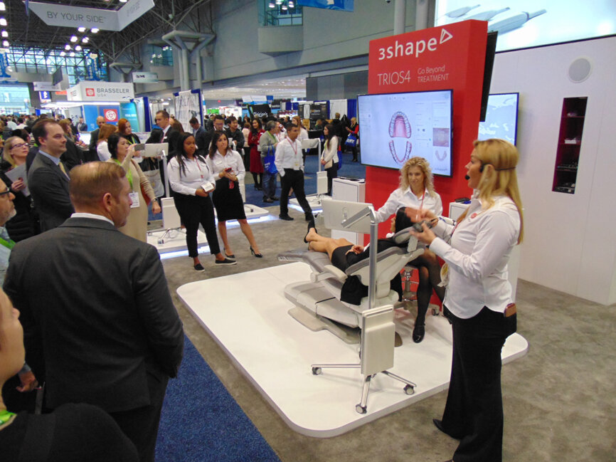 Meeting attendees gather around at 3Shape for a presentation. (Photo: Fred Michmershuizen/DTA)