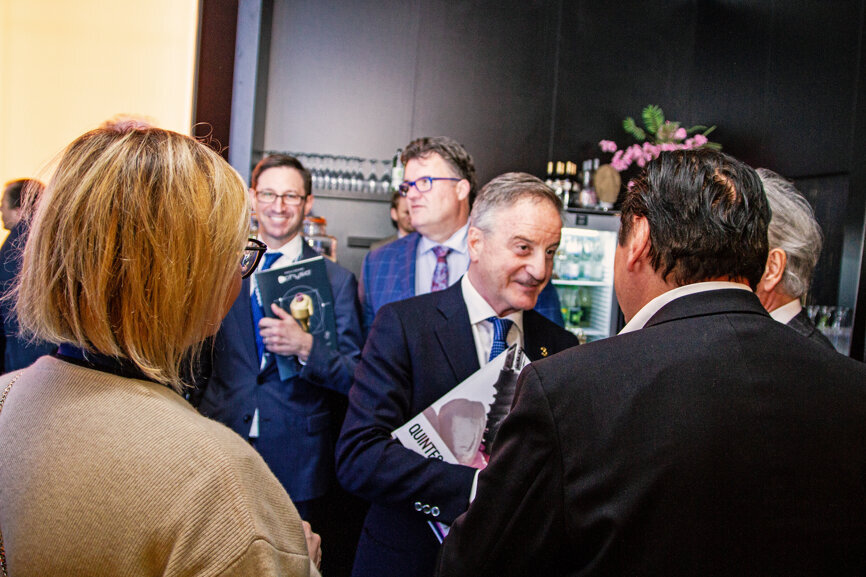 Prof Tiziano Testori (middle) from the Lake Como Institute with attendees at the Channel3 booth party.  (Photograph: Luke Gribble, DTI)
