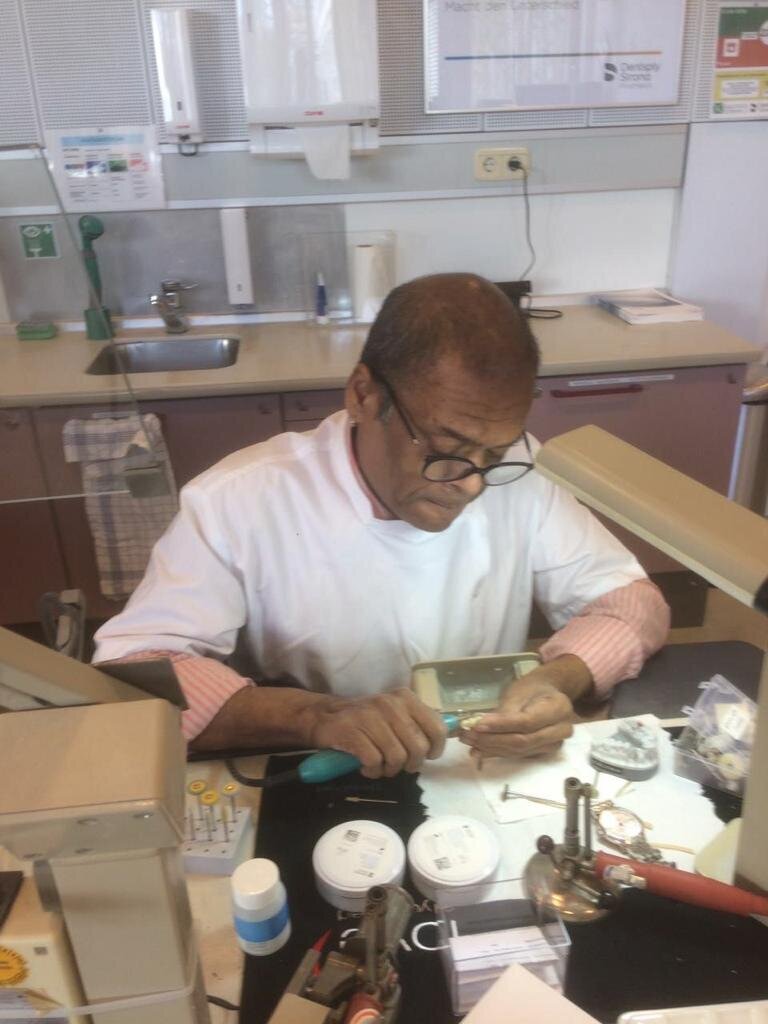The master dental technician immersed in work