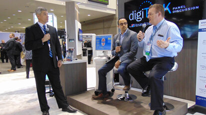 From left: Michael Porro of Henry Schein Dental leads a digiTALK presentation on the digital workflow with Dr. Meena Barsoum and Dr. Joe Favia. It was one of many digiTALKs offered throughout the day in the Henry Schein booth. (Photo: Fred Michmershuizen/Dental Tribune America)