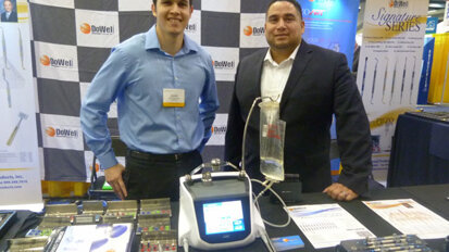 David Mendiela and Ricardo Gonzalez stand ready at the DoWell booth.