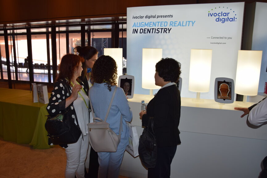 Attendees viewing Ivoclar Vivadent's soon-to-be-released Smile Visualizer app.