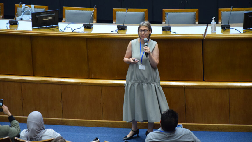 Prof. Laura Ceballos presenting her lecture, titled 