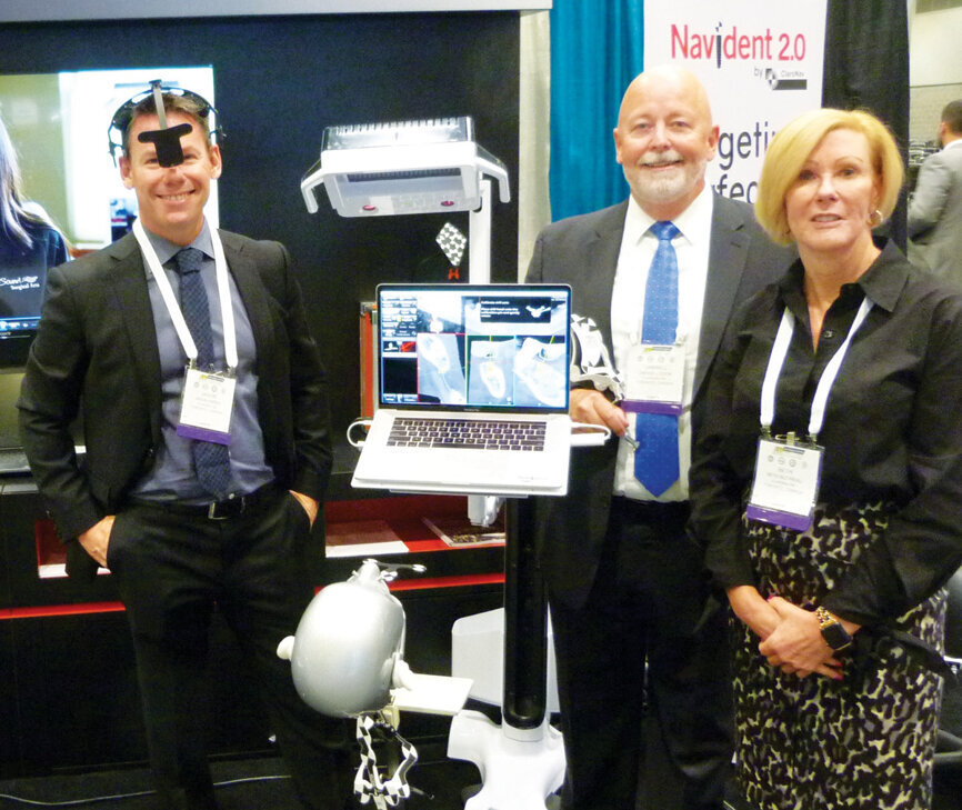 The group from ClaroNav stands ready to give a hands-on demonstration of the newest software from Navident. (Photo: Sierra Rendon/DTA)