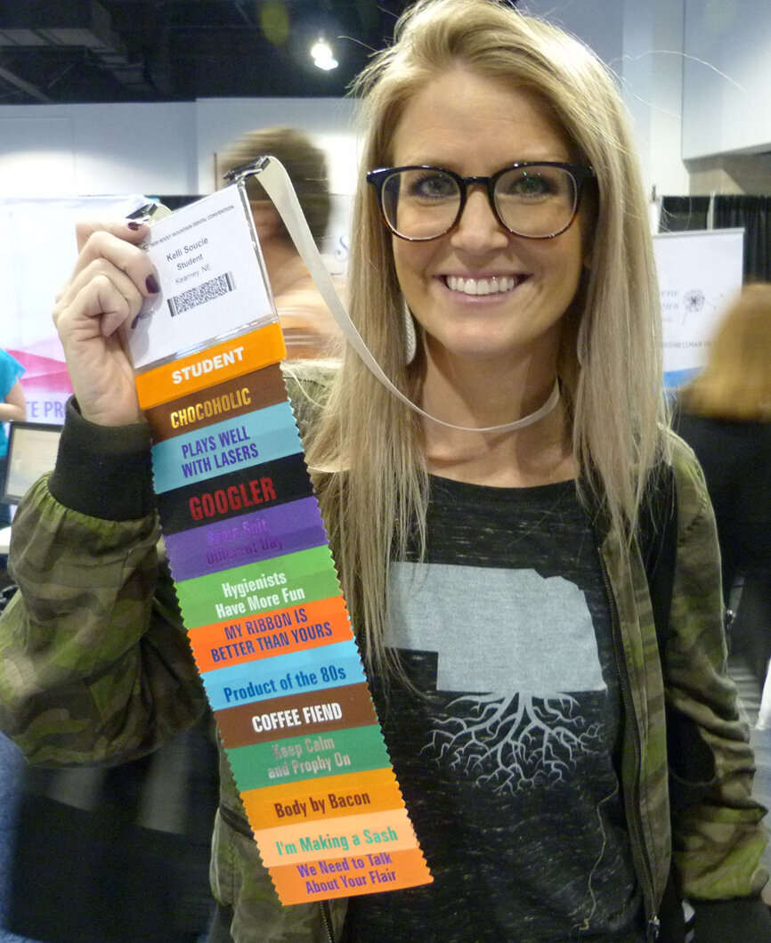 Kelli Souci, dental hygiene student in second-year of school at Central Community College in Hastings, Neb., shows off the flair she added to her RMDC badge.