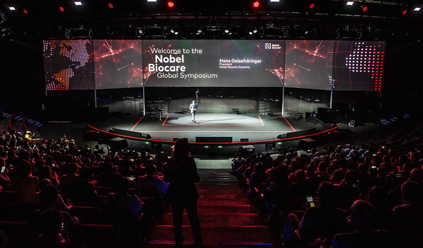 Opening of the Global Symposium with President Hans Geiselhöringer on stage. (Photograph: Nobel Biocare)