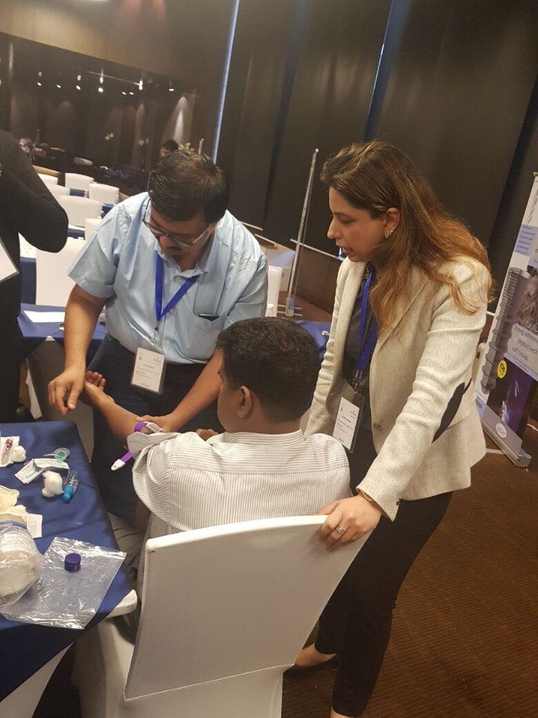 Dr.Ritika Arora guides a participants during hands on