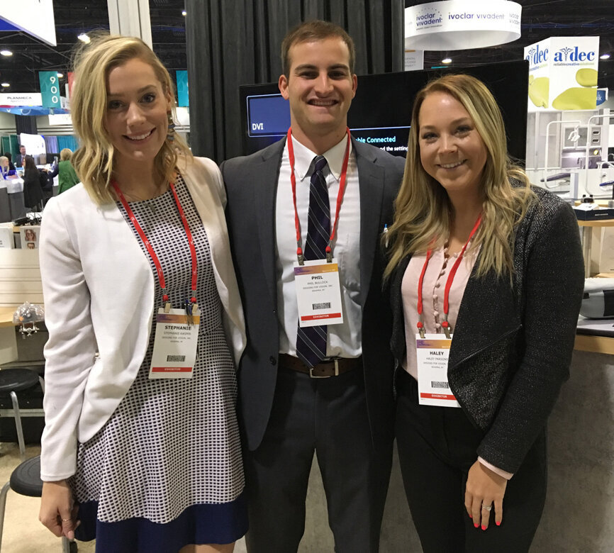 From left, in the Designs for Vision booth, are Stephanie Kasper, Phil Bullock and Haley Parsons.