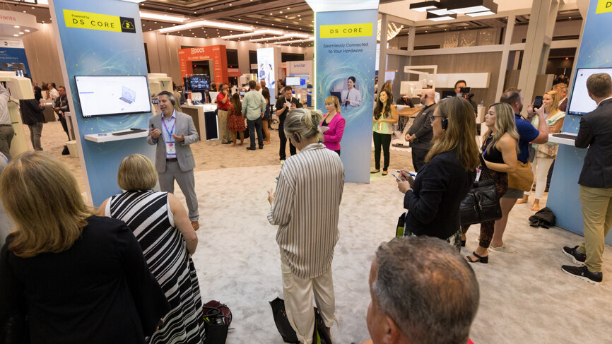 DS World 2022 attendees learn about the cloud-based DS Core program in the main exhibition area.
