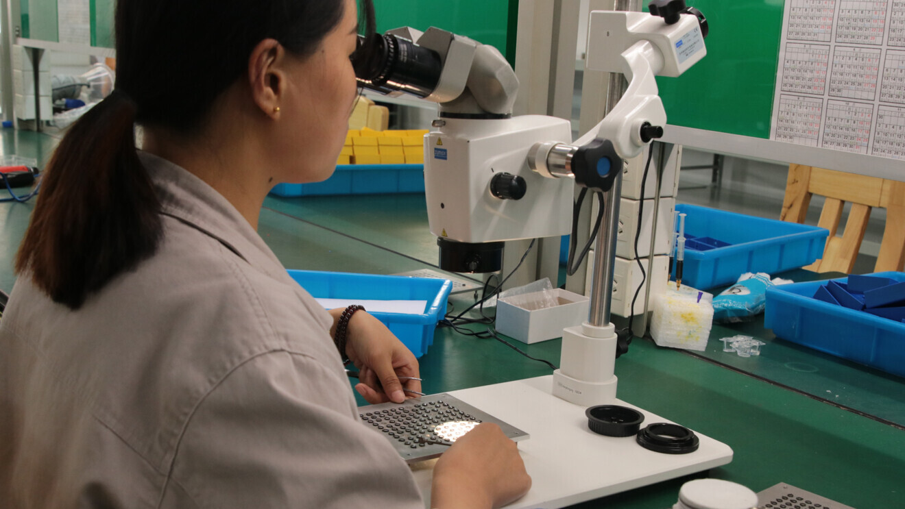 Quality inspection of the Zumax optical system.