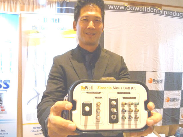 In the DoWell Dental Products booth, Terry Cha displays the Zirconia Sinus Drill Kit.