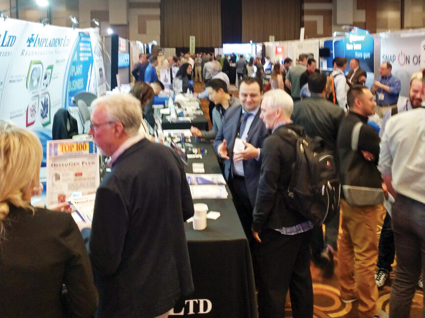 AAID Annual Session attendees pass through aisles and aisles of the latest dental implant products.