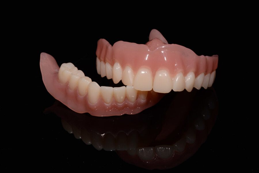 Fig. 22: Definitive complete dentures after final polishing.