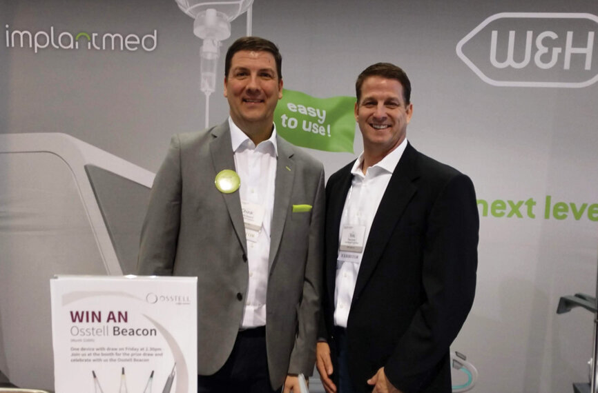 Chuck Harper, left, and Ron Armin at the Osstell/W&H booth.