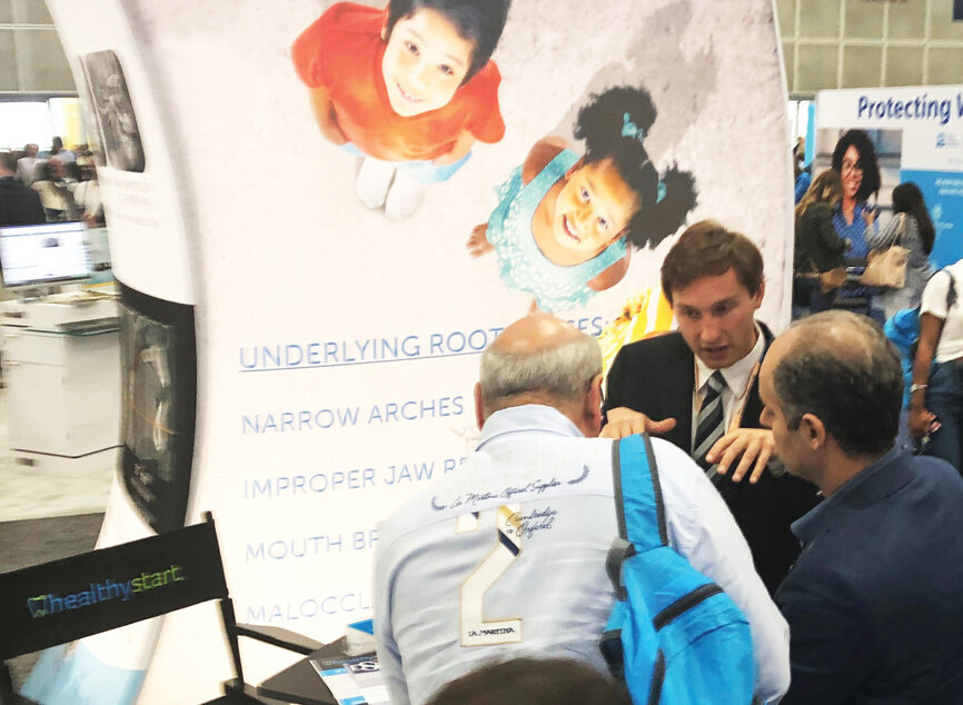 Joe Belbie of Healthy Start talks to attendees about Ortho-Tain, an appliance used to treat sleep-related breathing disorder symptoms.