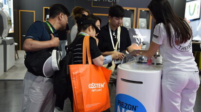 Participants engage with the latest product innovations at the EMS booth.