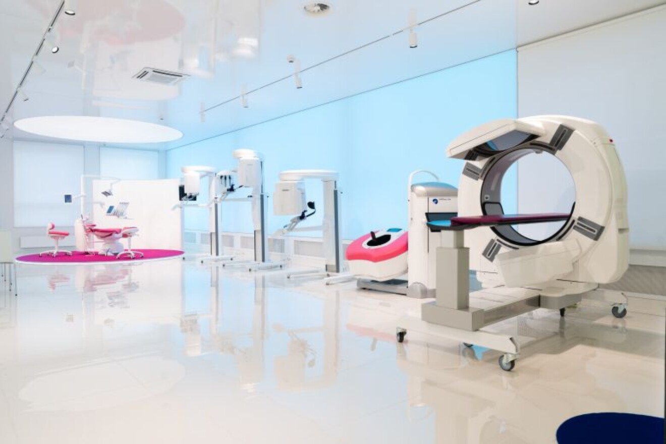 At the forefront, Planmed XFI—a full-body weight-bearing CBCT system for orthopaedic imaging.