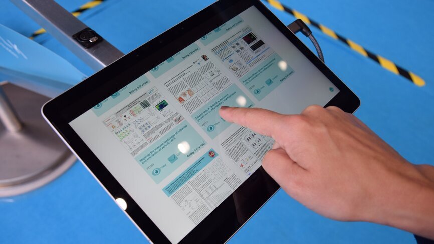 This year, to reduce paper, visitors browsed poster presentation on multimedia devices.