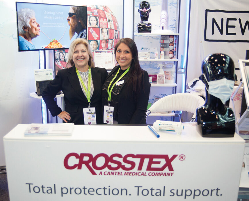Gaylene Baker, left, and Danielle Walters of Crosstex. (Photo: Jahmel Charles, Dental Tribune America)