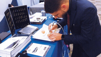 Thiago Alves of Piezosurgery Inc. demonstrates the precision offered by the company’s advanced technology. Photo by Sierra Rendon/DTA