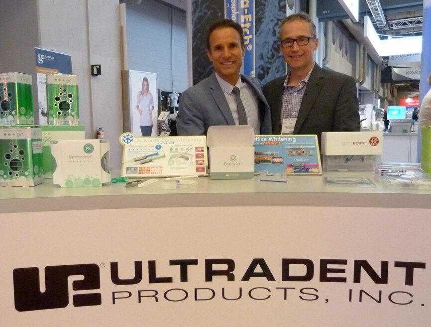 From left, Nicolas Sondaz and John Pittendreigh in the Clinical Research Dental Supply and Service booth.