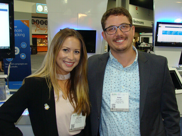 Marcela Leon, left, and Peter Biro of DemandForce.