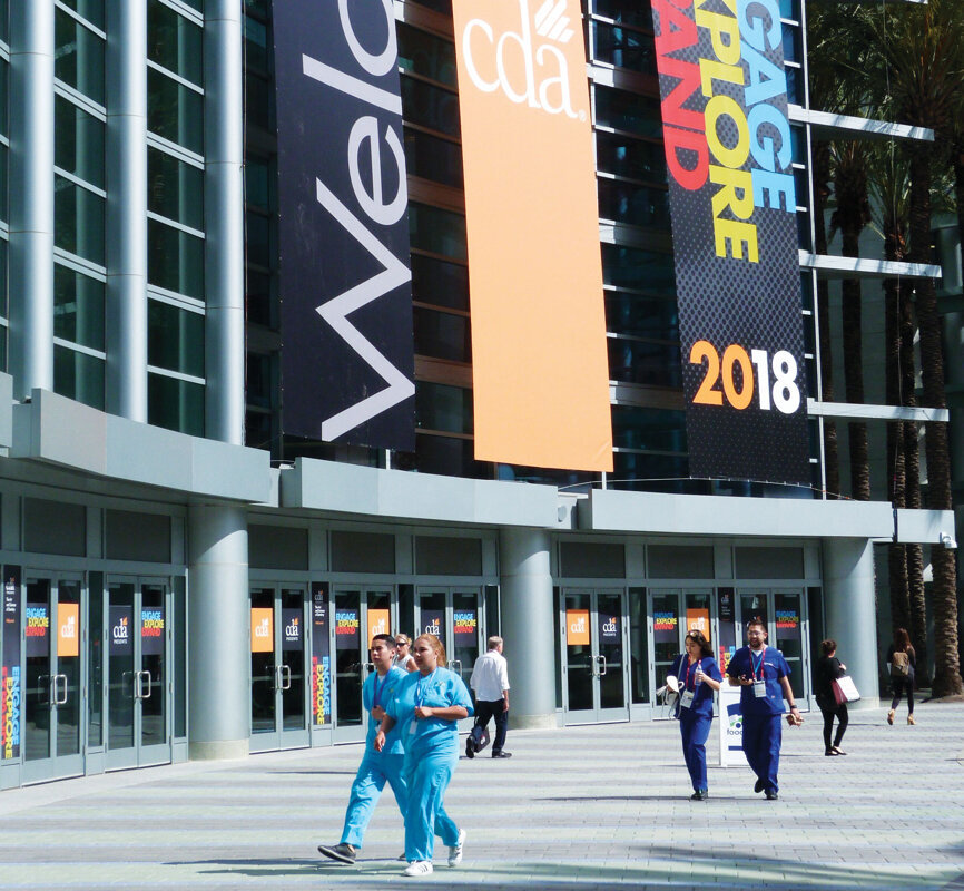 Attendees stream into the first day of the CDA annual session in Anaheim, Calif.