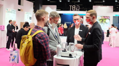 Visitors to EMS Dental enjoy the colourful atmosphere. (Image: Dental Tribune International)