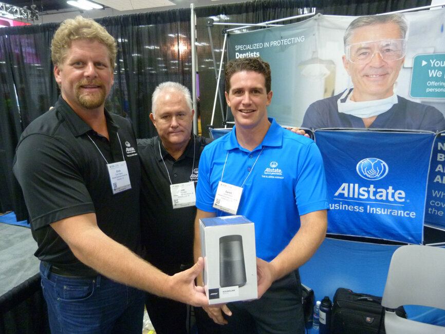 From left: Erick Ellgren, Les Leber and Garett Blake in the Allstate Business Insurance booth. (Photo: Robert Selleck/DTA)