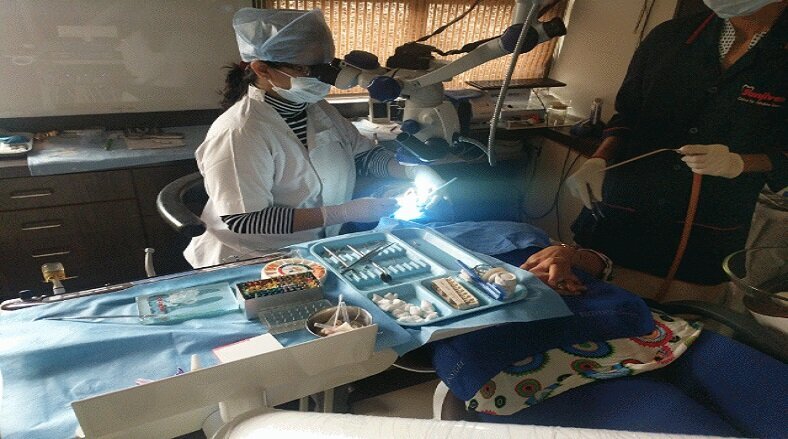 Dr.Hetal Nigam Buch working with her Microscope.