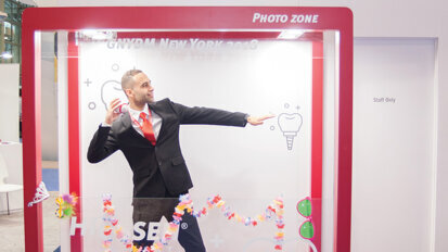 Eslam Elgamel of Hiossen Implant shows off his quarterbacking technique. (Photo: Jahmel Charles, Dental Tribune America)