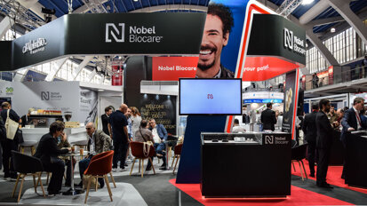 The well-attended Nobel Biocare booth on the first day of the congress. (Photograph: DTI)