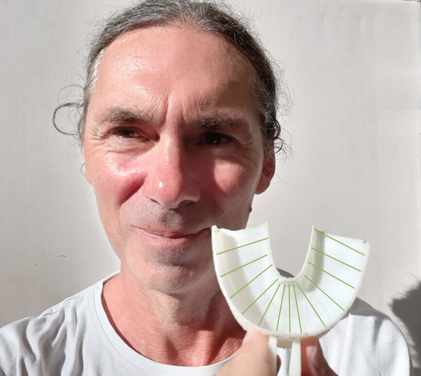 Creator of the Blizzflosser, Chris Martin and the results of years of development, a Blizzflosser device.