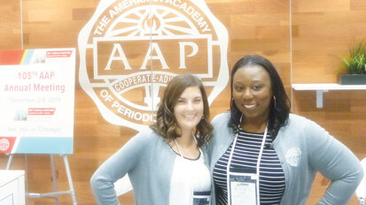 Julie Flanigan, left, AAP marketing and digital communications manager, and Mame Kwayie, AAP’s public relations manager, at the AAP Membership booth. (Photo: Sierra Rendon/DTA)