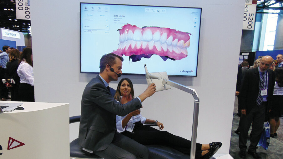 Rune Fisker of 3Shape demonstrates the company’s new TRIOS MOVE during a press conference at the 2018 Midwinter Meeting in Chicago. (Photo: Fred Michmershuizen, DTA)