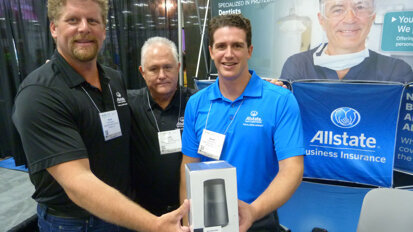 From left: Erick Ellgren, Les Leber and Garett Blake in the Allstate Business Insurance booth. (Photo: Robert Selleck/DTA)