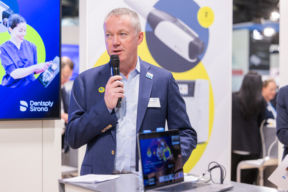 Simon Campion speaking at the Dentsply Sirona press conference at IDS 2025. 