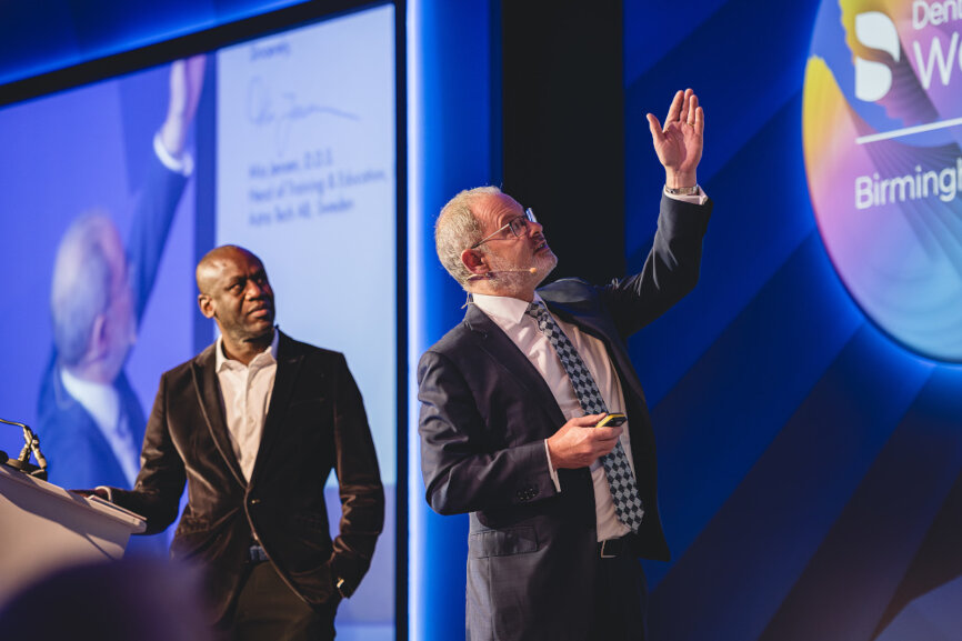 Dr Martin Wanendeya (left) on stage with Dr Michael Norton.