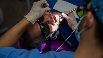 Laser-assisted protocol for the treatment of peri-implantitis: A long-term retrospective case series