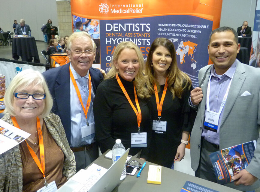 From left in the International Medical Relief booth are Mary Lou Volimer, RDH, Donald Vollmer, DDS, Shauna King, Joelle Letlow and Saul Escala, DDS. (Photo: Robert Selleck/Dental Tribune America)