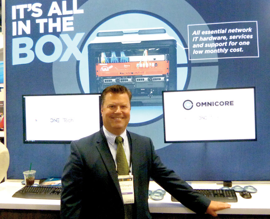 Bryan O’Loughlin offers a demonstration of TechCentral’s newly launched OmniCore, at the Henry Schein One booth. (Photo: Sierra Rendon, DTA)