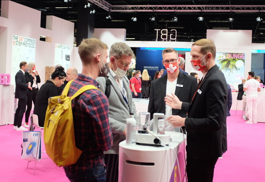 Visitors to EMS Dental enjoy the colourful atmosphere. (Image: Dental Tribune International)