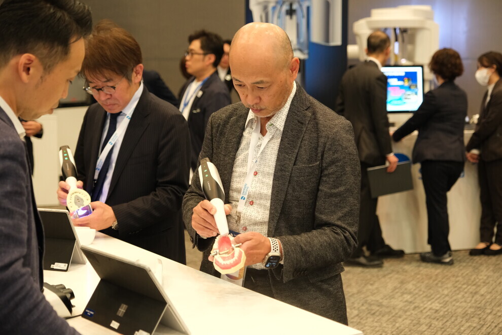 Participants engage with the latest Dentsply Sirona products at DS World 2024 in Tokyo.