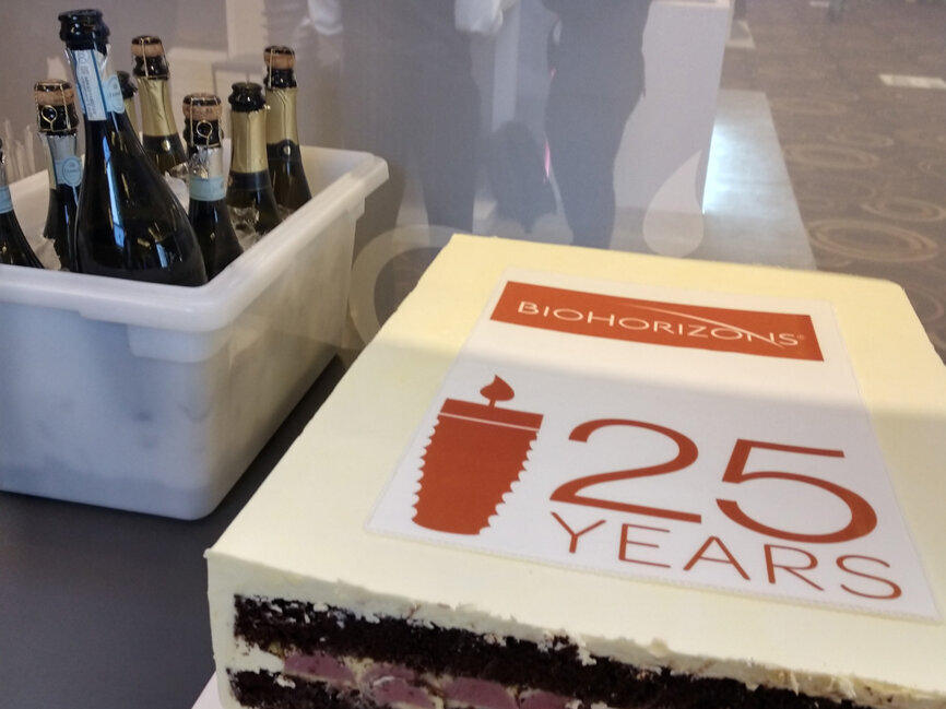 BioHorizons offers a celebratory cake at its booth, to commemorate 25 years in business. 
