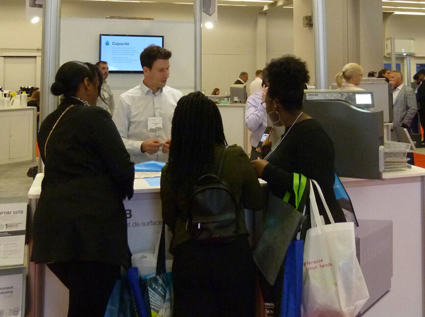 Julien Bruneau demonstrates Optim 33TB disinfectant wipes in the SciCan booth.