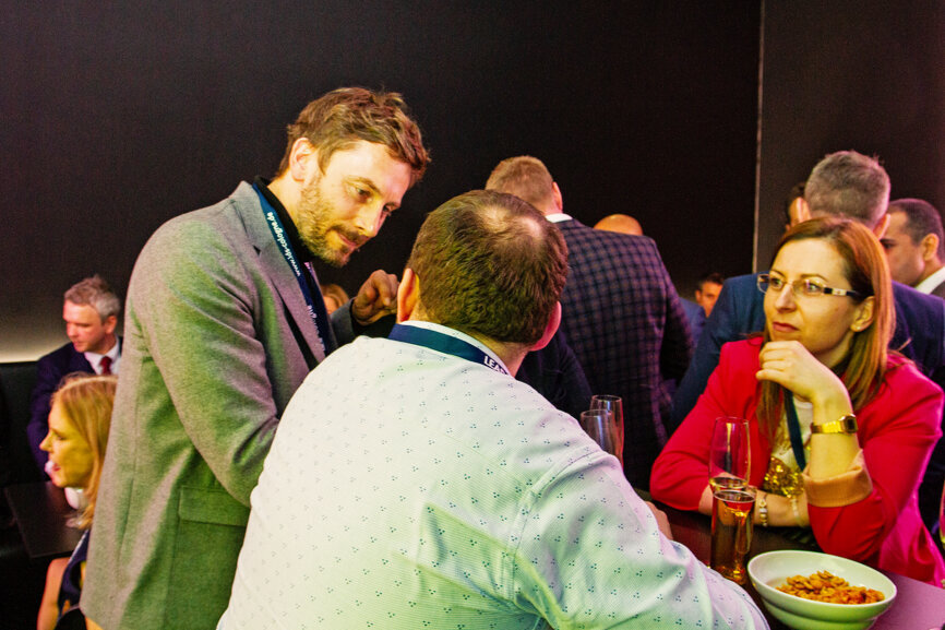 Attendees at the Channel3 night held at the OMEUS MEDIA/Dental Tribune International booth. (Photograph: Luke Gribble, DTI)
