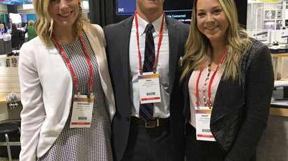 From left, in the Designs for Vision booth, are Stephanie Kasper, Phil Bullock and Haley Parsons.