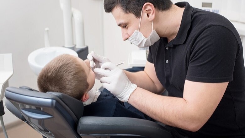 Dentist turns primary teeth black to explore caries management options