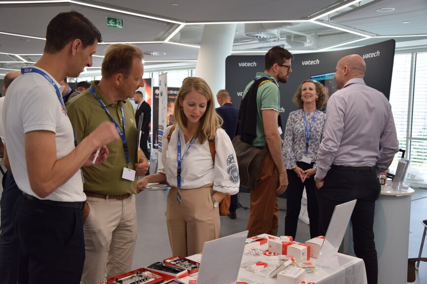 ROOTS SUMMIT 2022 attendees in the exhibition hall.